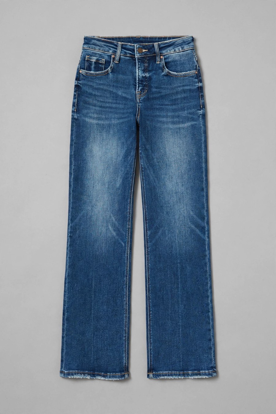 The RISEN Laila jeans, flat-lay front — medium-blue wash, high rise, pressed crease down the center front of each leg, golden topstitching.
